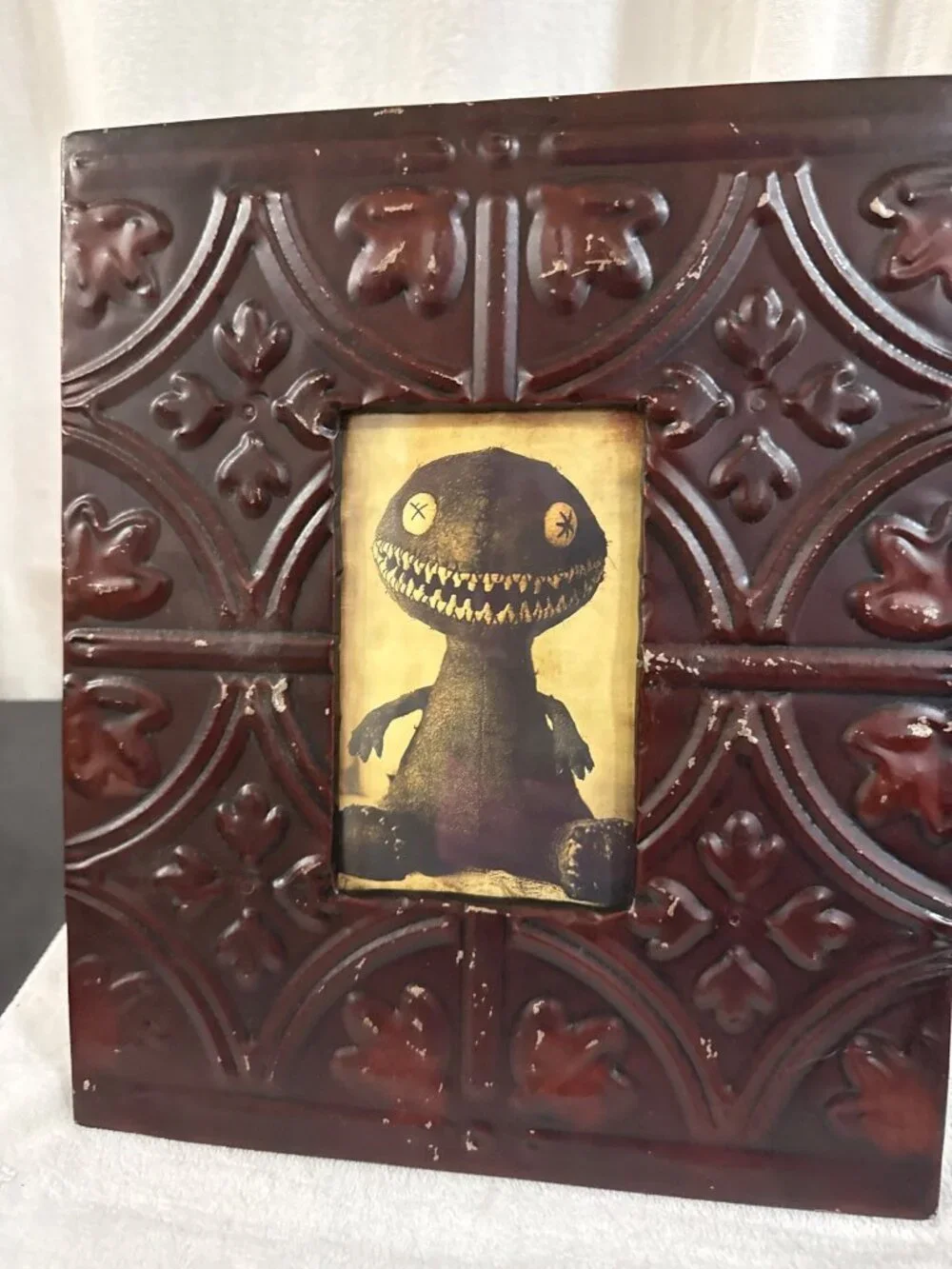 Vintage Embossed Tin Photo Frame With Gothic Motif And Creepy Doll Artwork